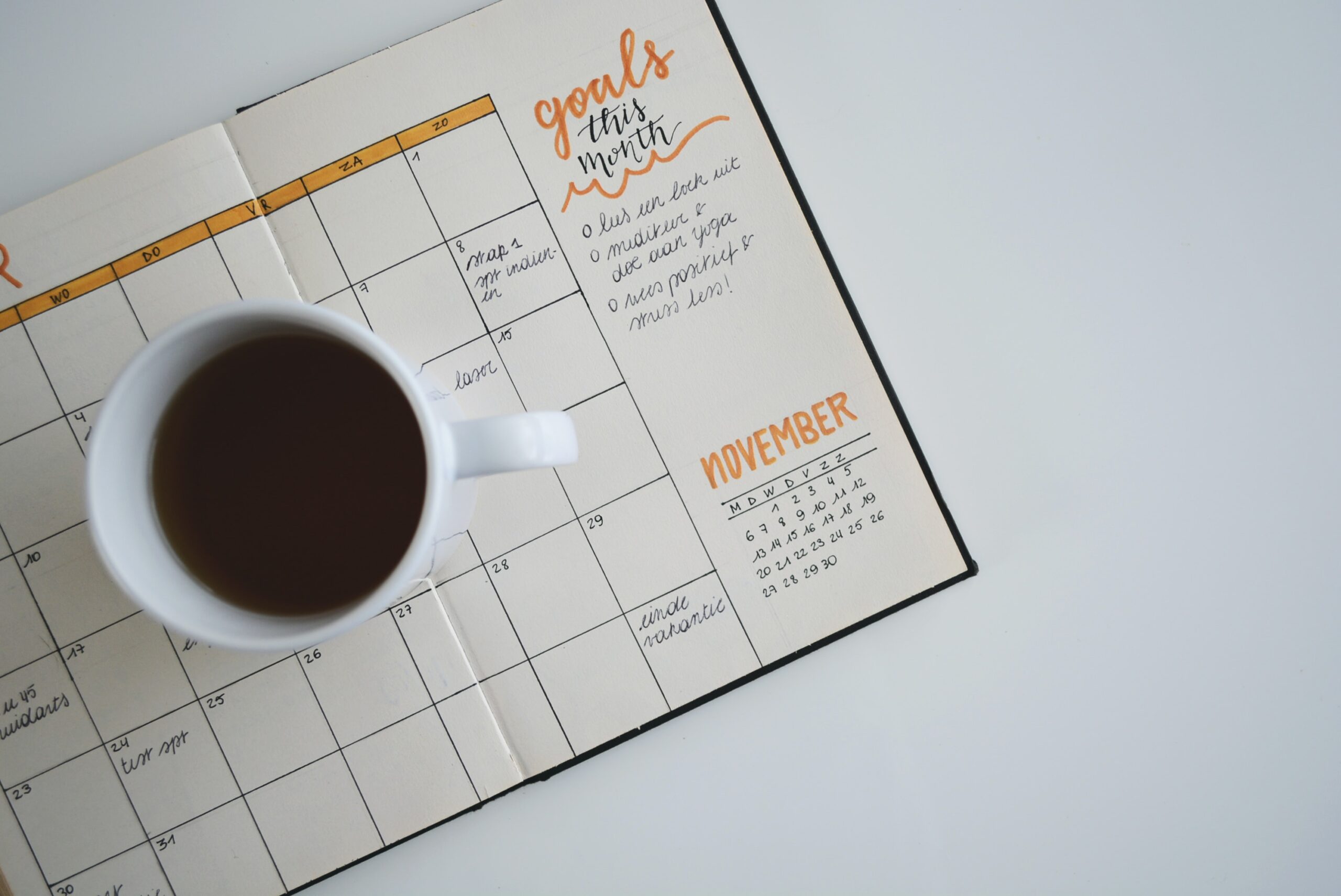 November calendar with a cup of coffee